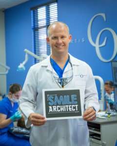 dr curtis with smile architect sign